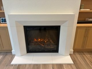 Modern gas fireplace with white stone surround in a Lakewood Ranch area living room