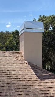 Stucco chimney chase with new galvanized cap on a Lakewood Ranch home