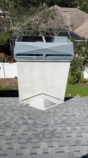 Stucco chimney with a new diamond-style galvanized cap, Osprey FL