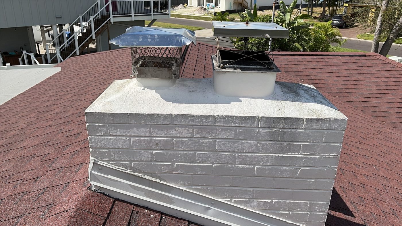 Chimney with two vent caps on a newer home under construction near Jacksonville